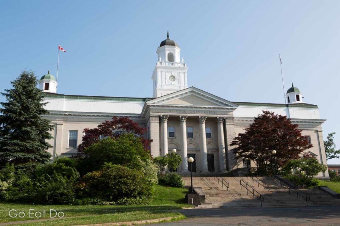 The facade of Acadia University in Wolfville, Nova Scotia Go Eat Do
