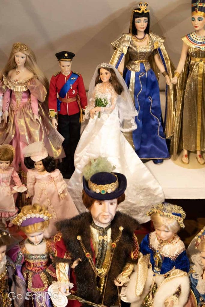 Dolls of Prince William, Duke of Cambridge, and Catherine, Duchess of Cambridge, in her wedding dress, on display among dolls in the Porcelain doll collection of Olga Gribule in Kraslava.