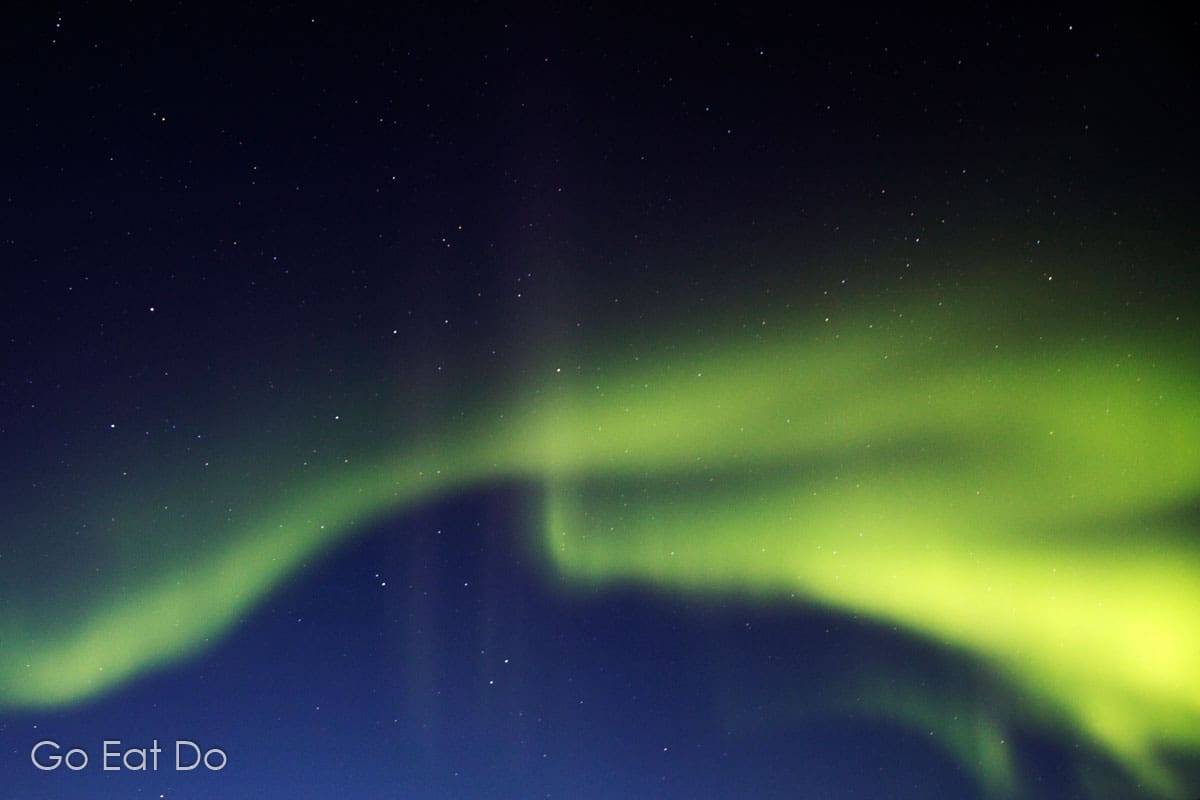 Green aurora borealis in the night sky. I was hoping to see them again ...