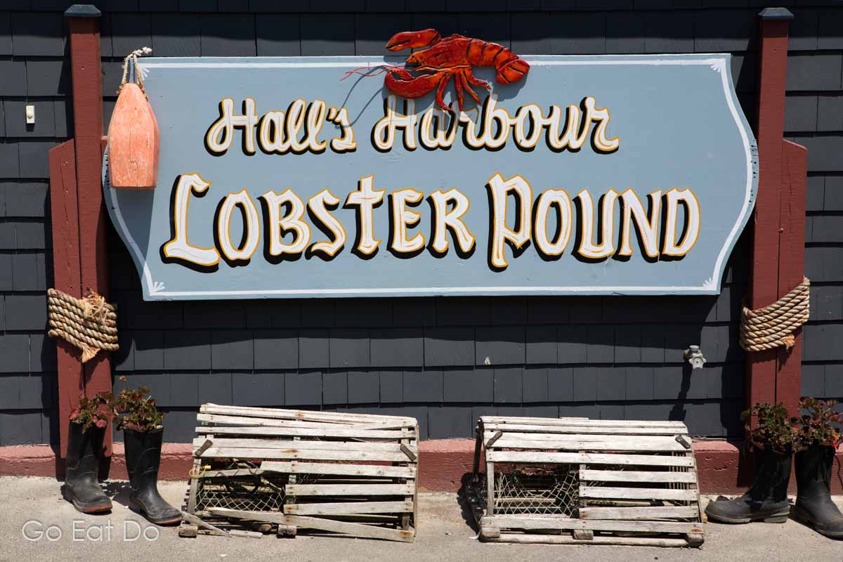 Sign at Hall's Harbour Lobster Pound in Nova Scotia which has a popular seafood restaurant.