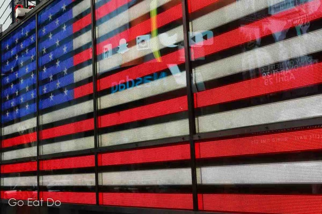 The Stars and Stripes on a giant screen at Times Square in New York City.