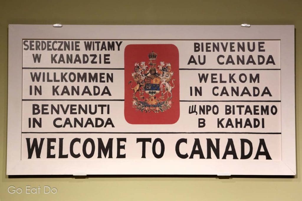 Multilingual 'Welcome to Canada' sign in the Canadian Museum of Immigration at Pier 21 in Halifax, Nova Scotia.