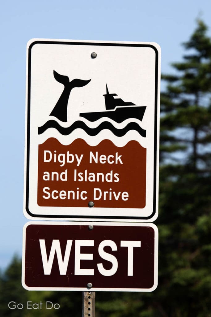 Sign for Digby Neck and Islands Scenic Drive in Nova Scotia, an area known for watching tours in the Bay of Fundy.