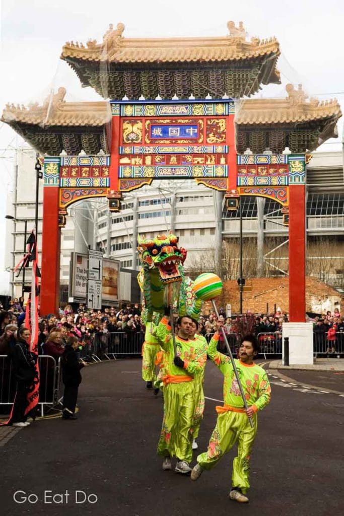 Members of Edmund Ng's Choi Lee Fut Kung Fu Club perform a dragon dance during Chinese New Year celebrations on the streets of Chinatown in Newcastle upon Tyne, England.