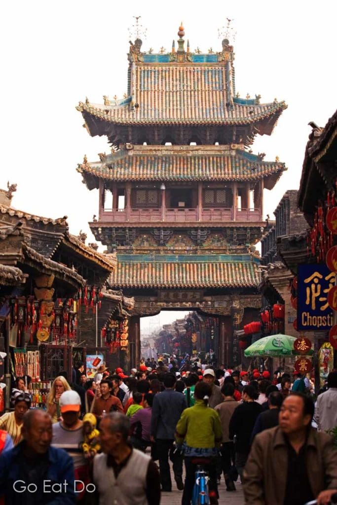 The Market Tower, one of the ancient city gates guarding entry to the UNESCO World Heritage Site city centre of Pingyao in Shanxi Province, China..