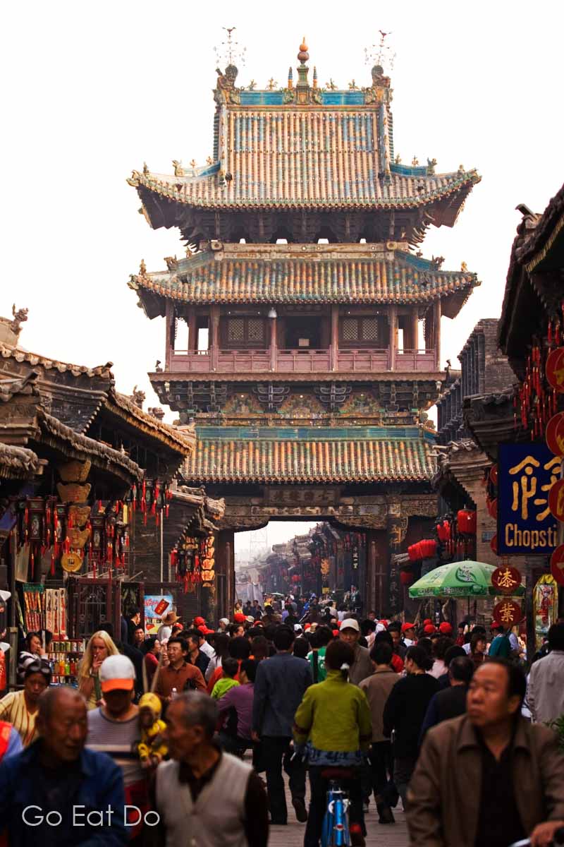 The Market Tower, one of the ancient city gates guarding entry to the UNESCO World Heritage Site city centre of Pingyao in Shanxi Province, China.