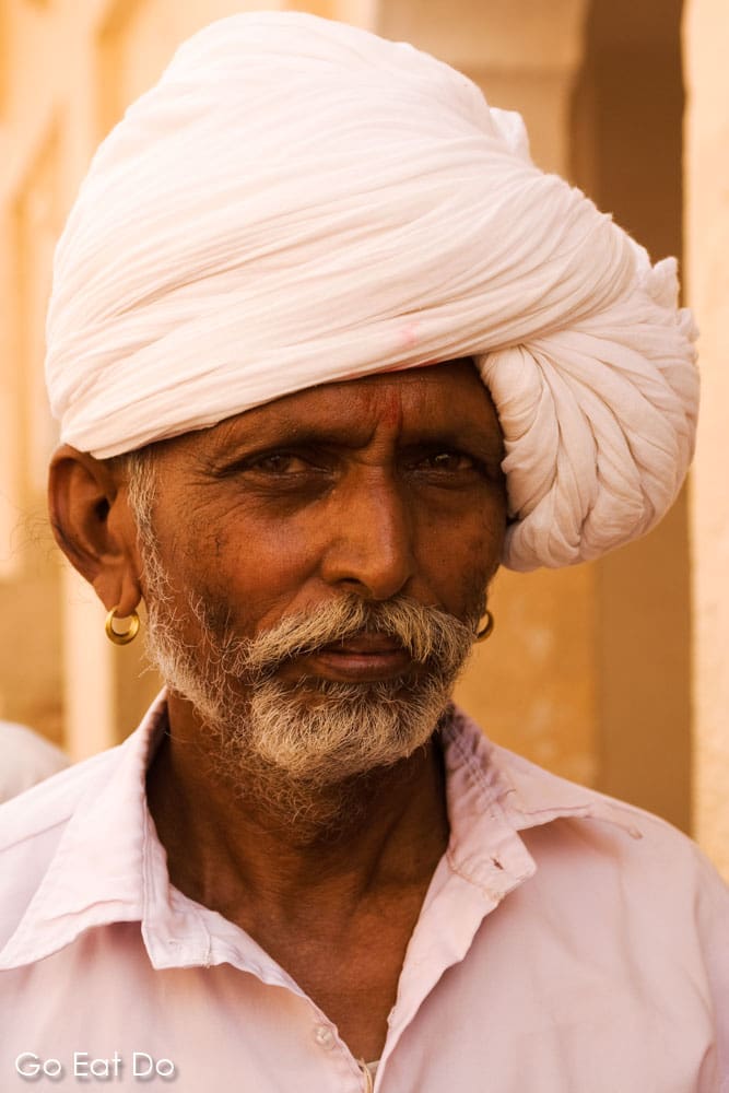 A man wears a white turban in Jodhpur, Rajasthan.