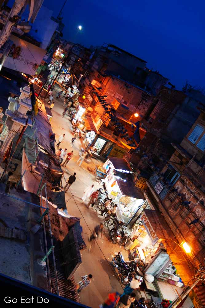 Shopfronts in Jodhpur, Rajasthan, viewed from a nearby rooftop during the blue hour.