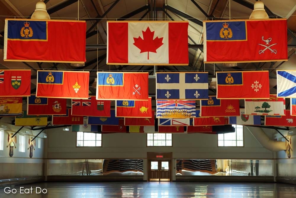 Flags representing Canadian provinces at the Royal Canadian Mounted Police (RCMP) Depot drill hall in Regina, Saskatchewan.