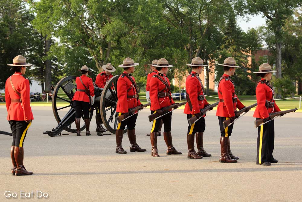 Members of the Royal Canadian Mounted Police wearing Stetsons and red serge jackets.
