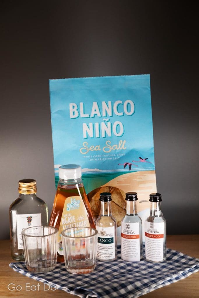 Blanco Nino tortilla chips, agave syrup and miniature bottles of mezcal and tequila.
