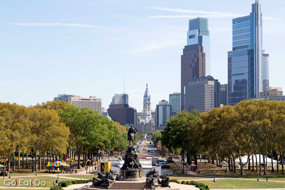 Philadelphia's skyline beyond the statue of George Washington on the Washington Monument fountain, seen from the steps of Philadelphia Museum of Art.