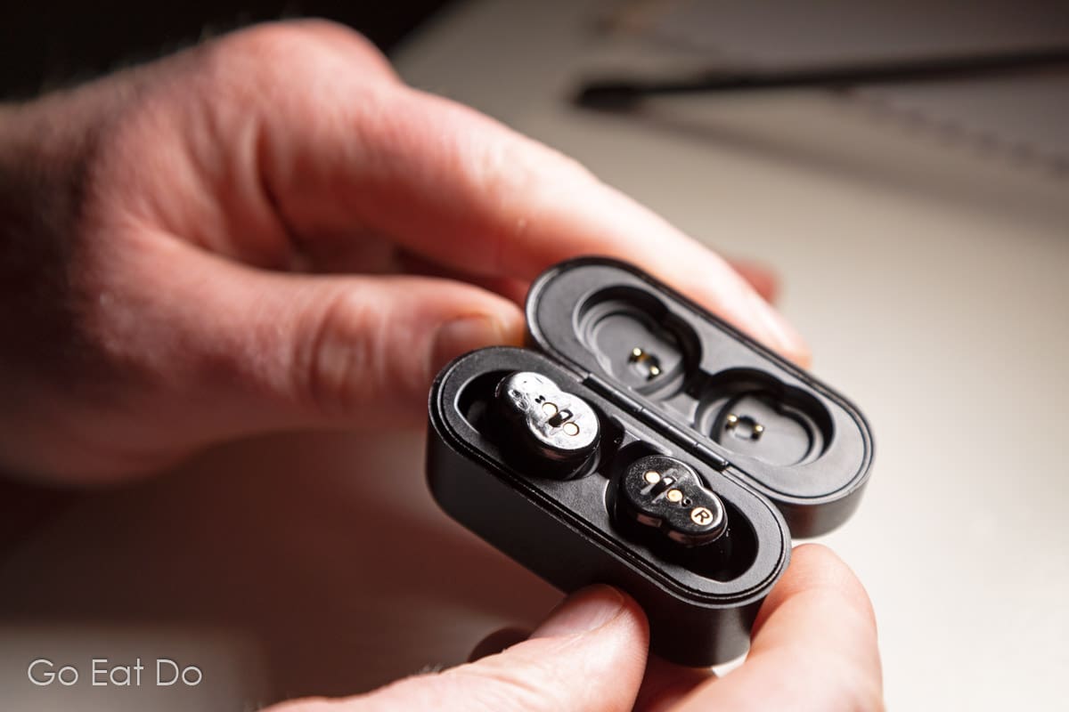 The noise-canceling earbuds are compact and store in the case in which they charge.