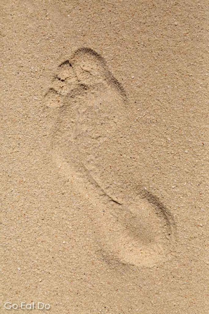 Footstep in the sand on a Maldives island resort.