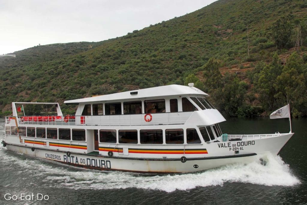 The Vale do Douro passenger ship cruises along the River Douro in Portugal.