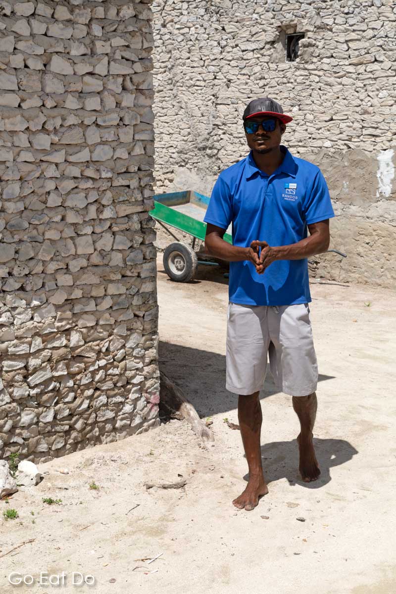 Tour guide discussing traditional construction methods on Huraa Island, one of the Maldlives' local islands.