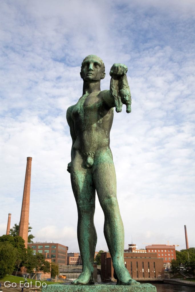 One of the bronze statues sculpted by Wäinö Aaltonen on the Hämeensilta Bridge.