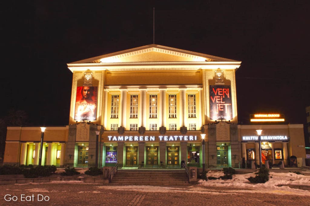Illuminated facade of the Tampere Theatre, one of the many places that art and culture aficionados may enjoy visiting while in the Finnish city.