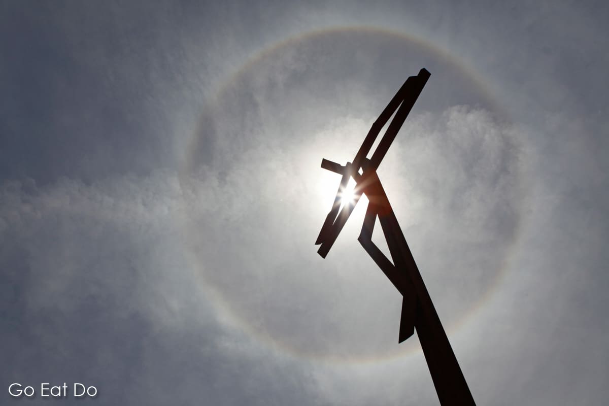 Solar halo or a new Miracle of the Sun in Fatima, Portugal? The sun bursts through Robert Schad's High Cross (Cruz Alta) sculpture.