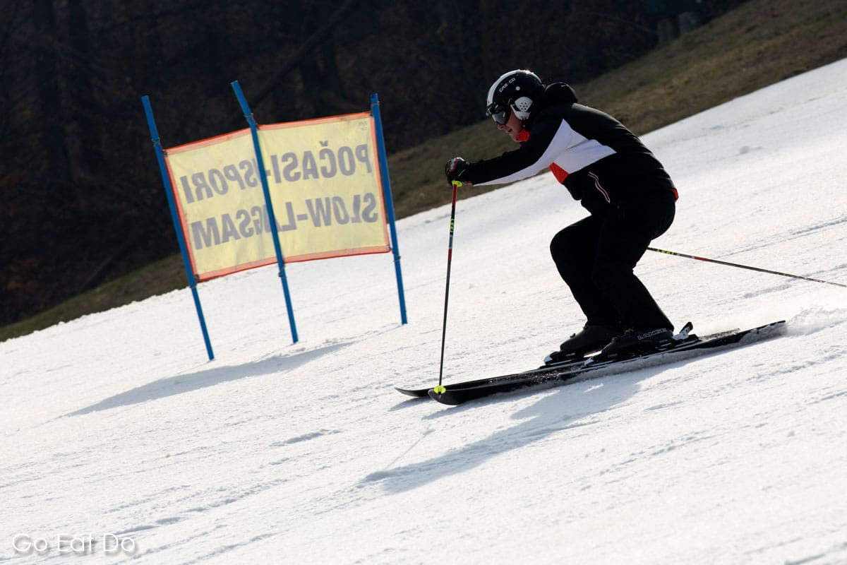A skier on a piste in the Maribor Pohorje Mountain Range, the venue of the annual Golden Fox slalom races for women.