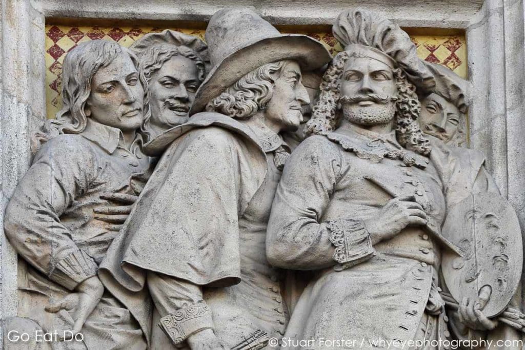 Bas relief depiction of Dutch Golden Age artists on the facade of the Rijksmuseum in Amsterdam, one of the top art museums in the Netherlands