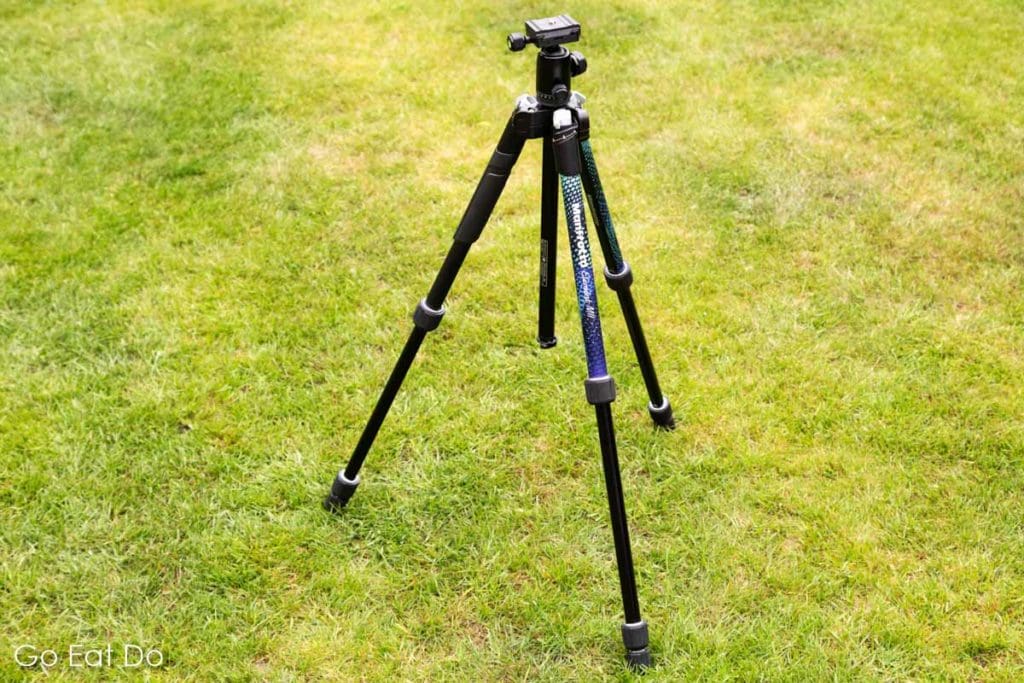 Manfrotto Element MII tripod on a lawn.