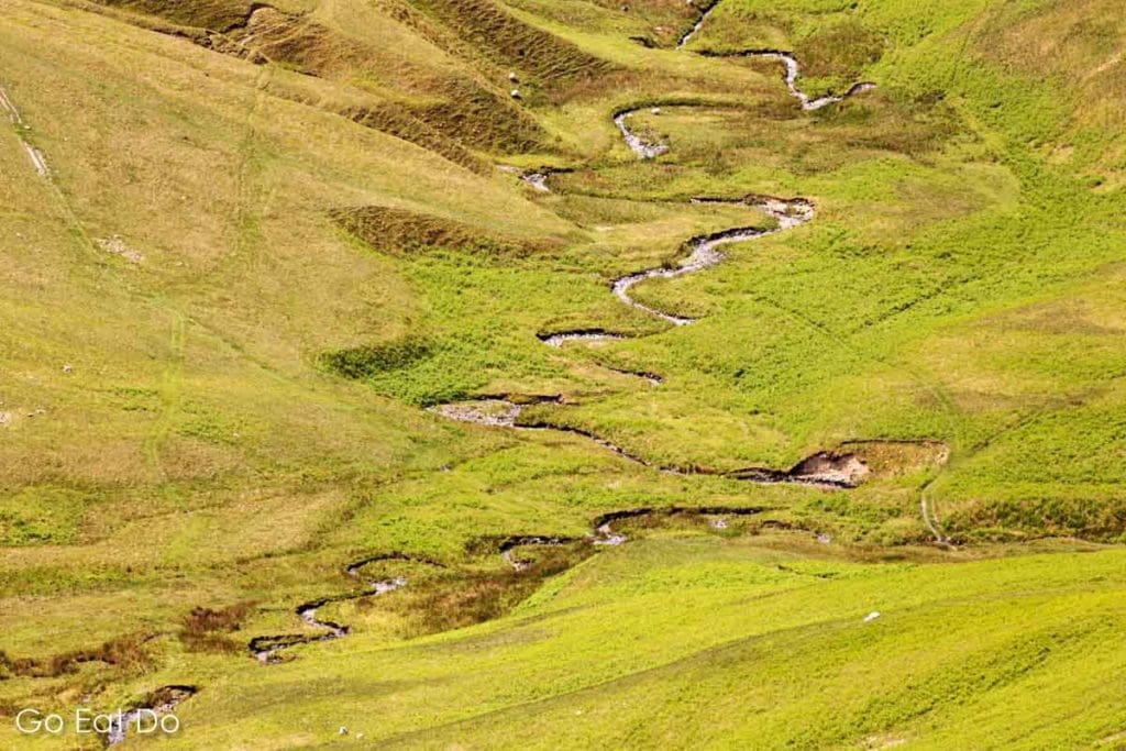 Meandering stream on a hillside above Sedbergh in the Yorkshire Dales National Park.