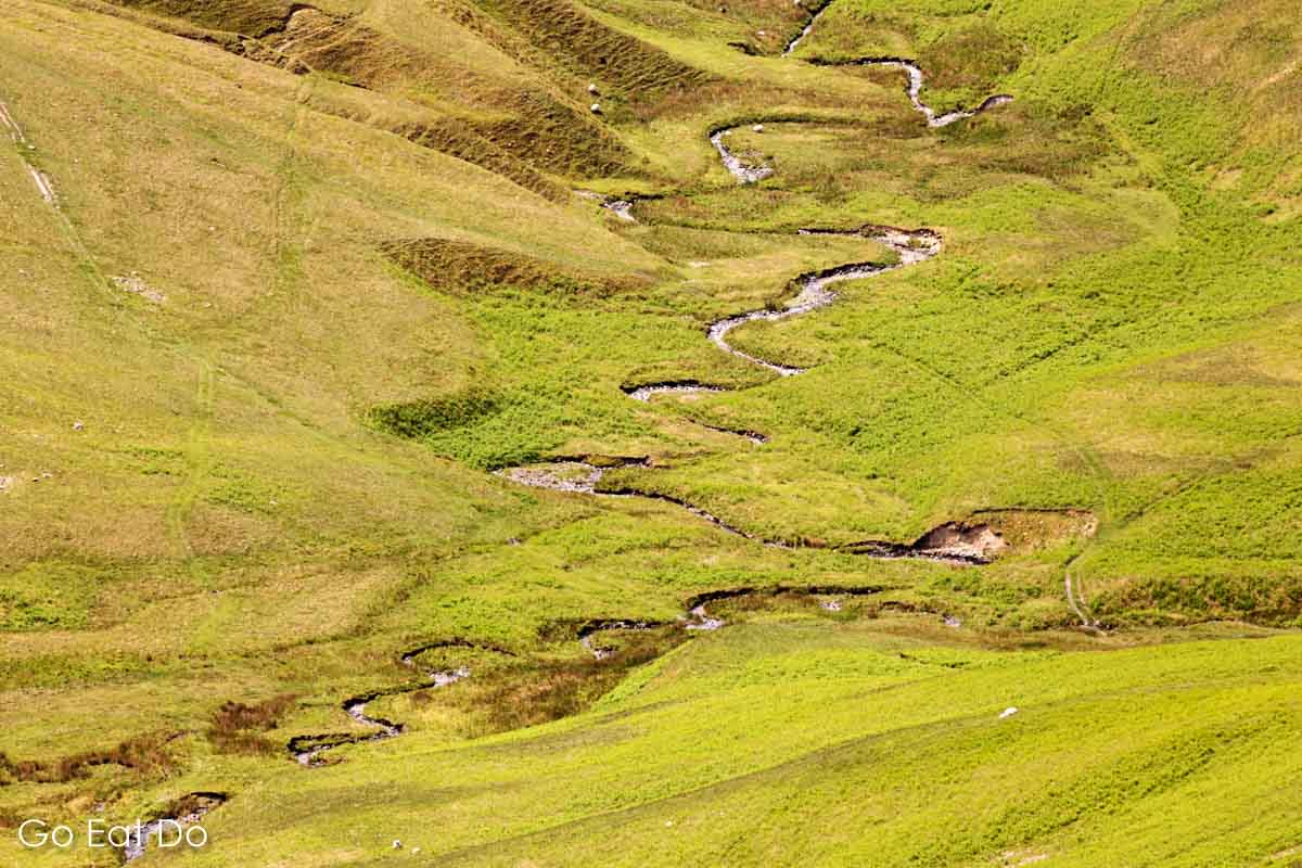 Meandering stream on a hillside above Sedbergh in the Yorkshire Dales National Park.