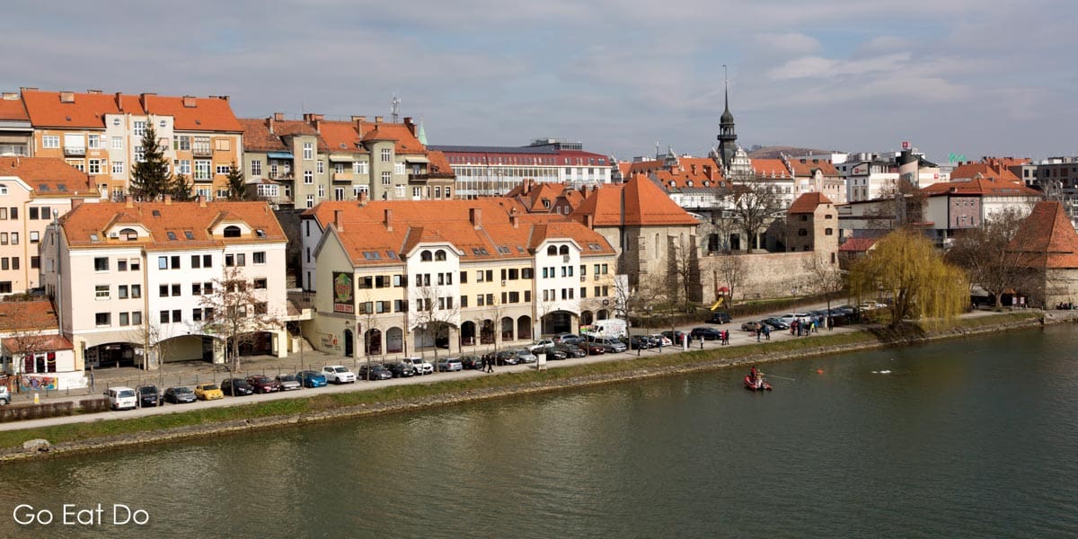 The River Drava flows part waterfront buildings in Maribor.
