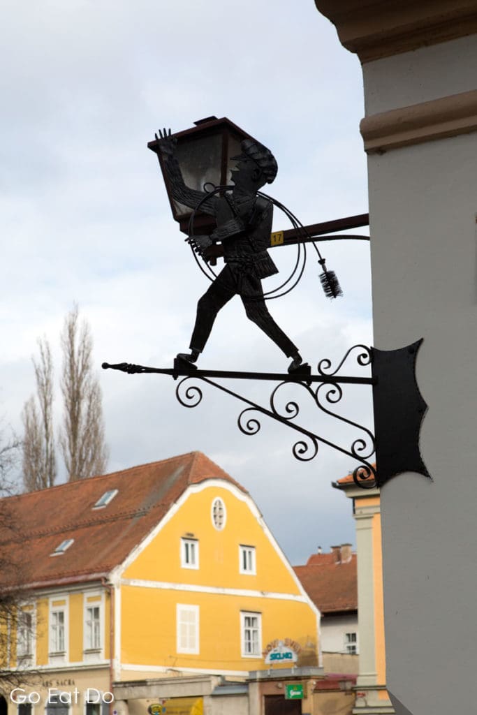 Wrought iron figure on the street corner at Postna ulica in Maribor, Slovenia.