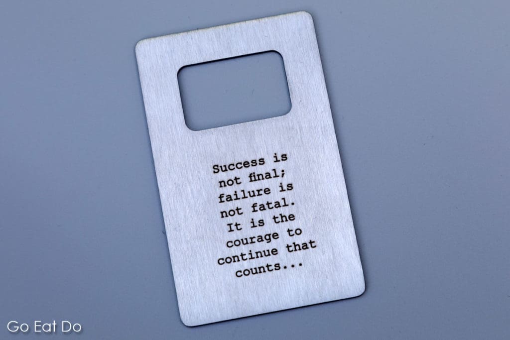 A bottle opener with a message about success, failure and the courage to continue.