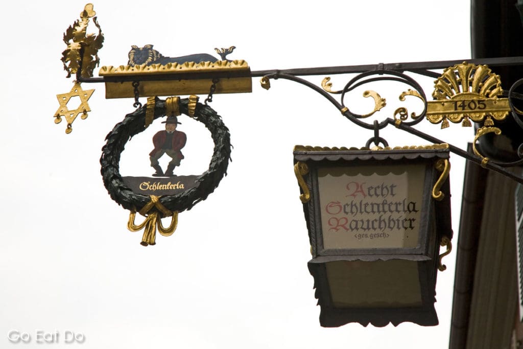 Ornate wrought iron sign outside of the Schlenkerla tavern in Bamberg, Germany