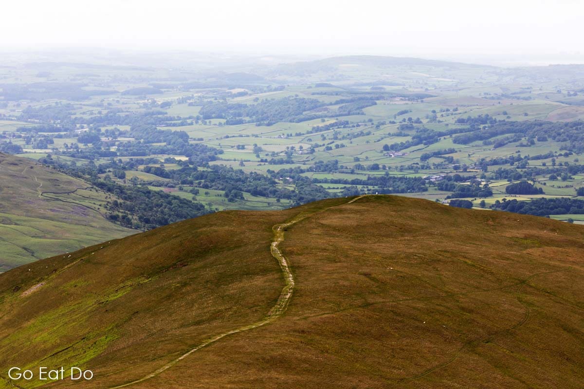 Footpath leading to the summit of Winder, one of the hills in the Howgill Fells near Sedbergh.