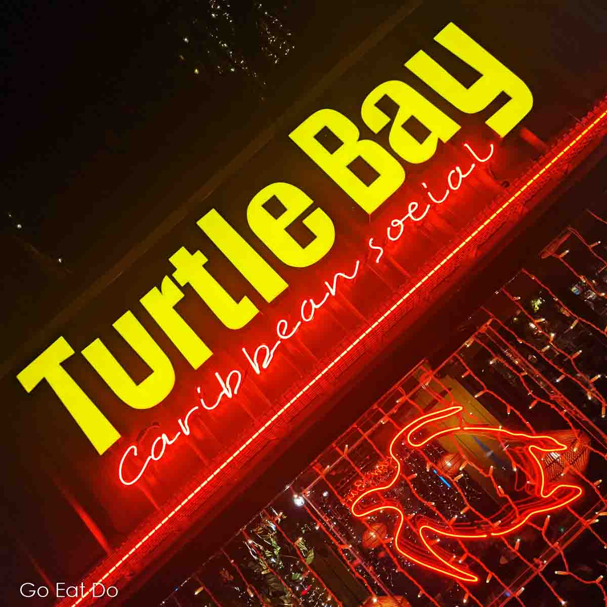 Illuminated sign for the Turtle Bay Caribbean restaurant in Durham City.