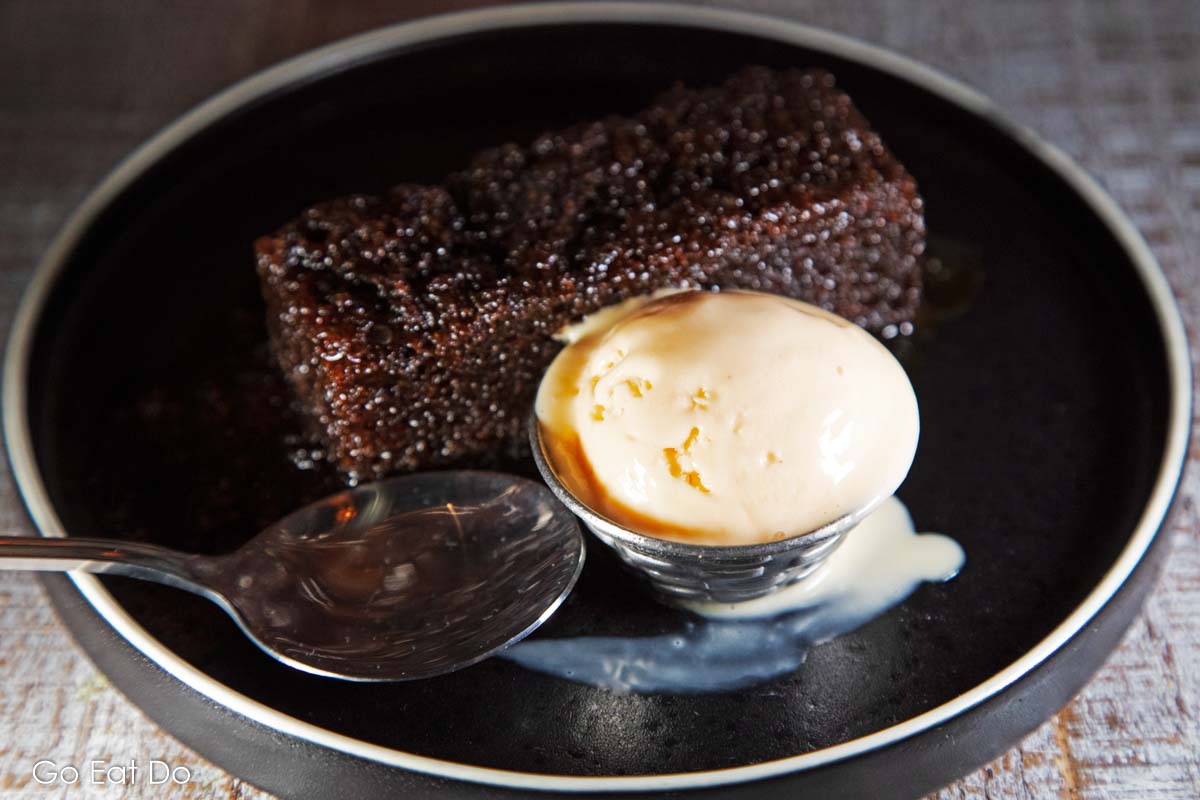 Sticky ginger pudding with a scoop of boozy Caribbean rum ice cream.