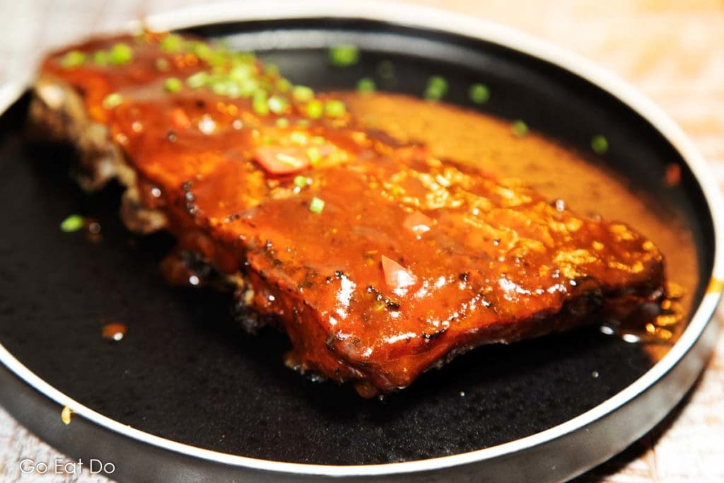 Turtle Bay's succulent marinaded jerk pit ribs slathered in mango barbeque sauce.