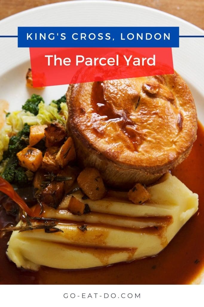Pinterest Pin for Go Eat Do's review of visiting and dining at The Parcel Yard King's Cross pub in London, England.
