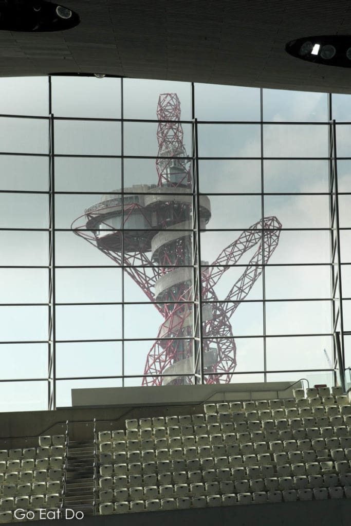 ArcelorMittal Orbit, one of the key attractions in London's Queen Elizabeth Olympic Park, seen through the window of London Aquatics Centre.