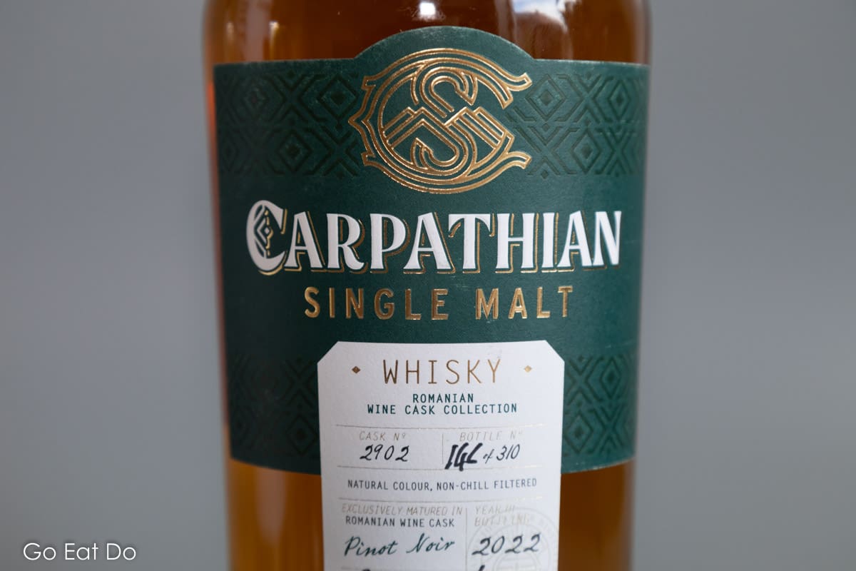 Label of a bottle of Carpathian Single Malt whisky bearing the signature of master distiller Allan Anderson.