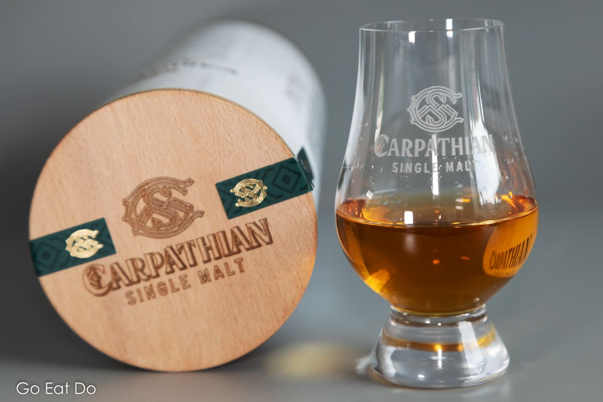 The Carpathian Single Malt logo with a glass of the Romanian whisky.