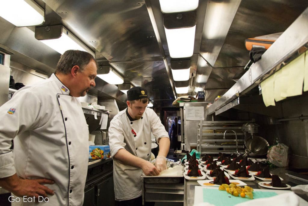 Executive Chef Jean Pierre Guerin observing food preparation aboard the Rocky Mountaineer.