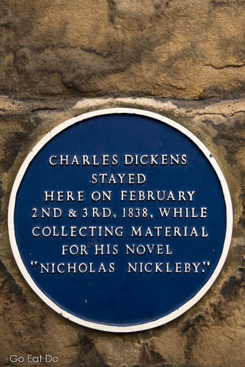Blue plaque with a reminder that Charles Dickens visited Barnard Castle while undertaking research