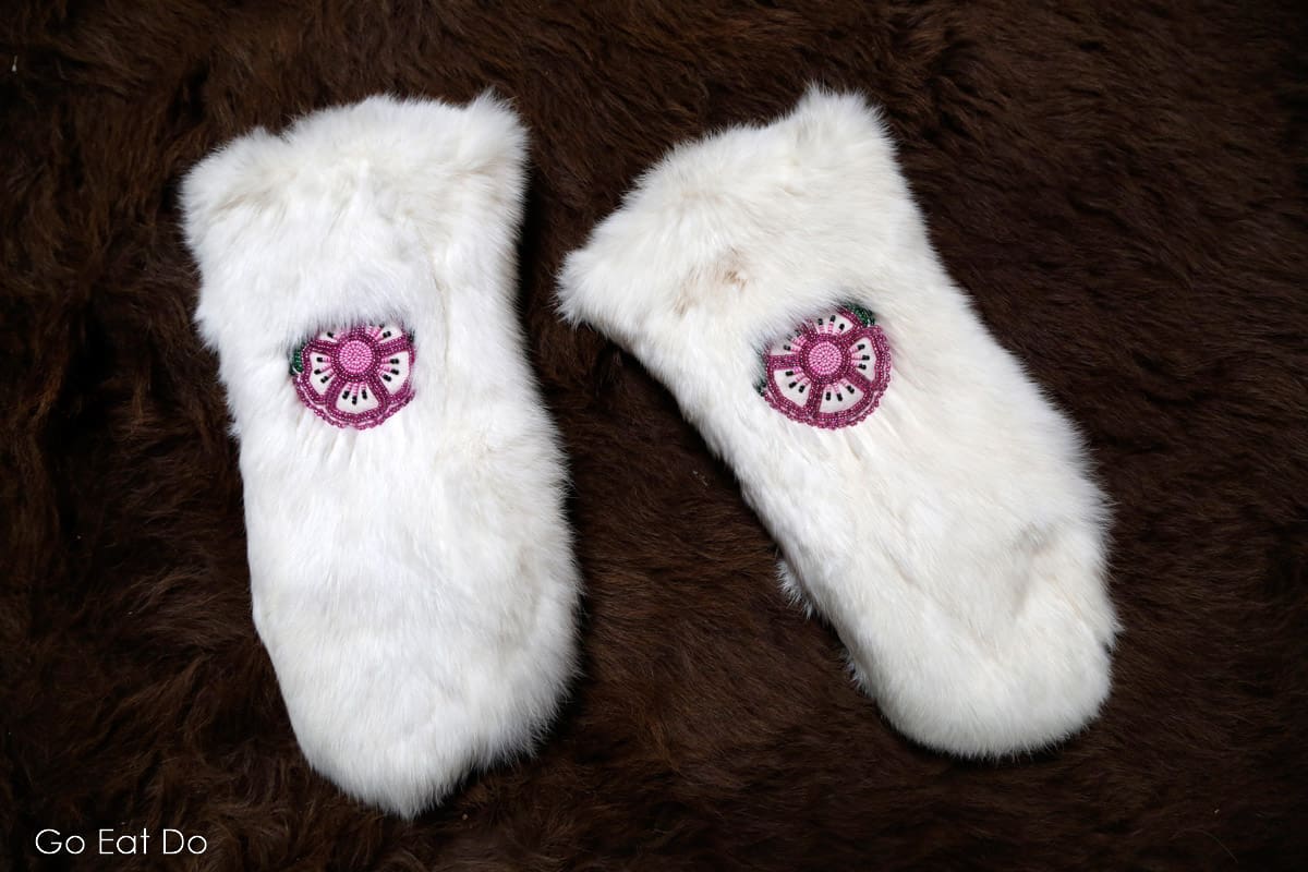 Fur mittens bearing traditional beadwork.