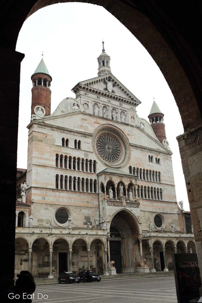 Facade of Cremona Cathedral in Cremona, Italy. The cathedral's Romanesque facade dates from the 13th and 14th centuries.