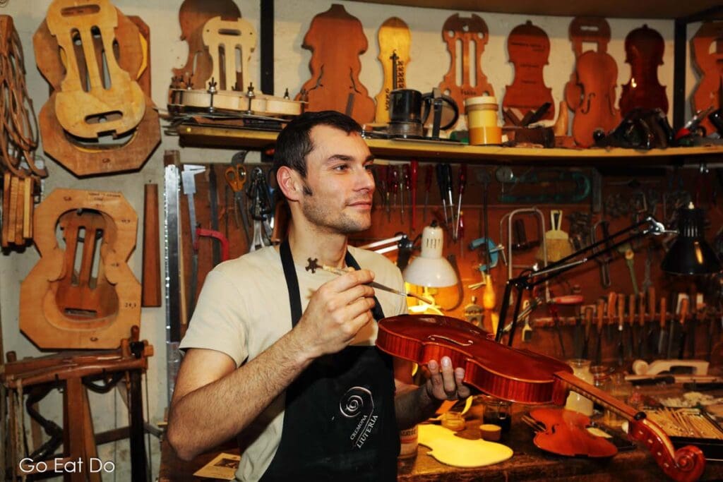 Master luthier Stefano Conio one of the many skilled violin makers in Cremona, Italy.