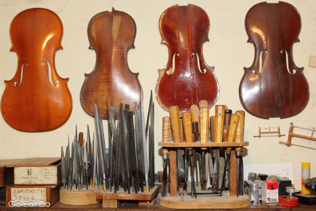 Violin makers in Cremona have workshops with unfinished instruments.