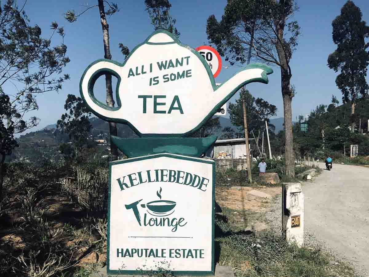 Teapot-shaped sign outside of the Kelliebedde Tea Lounge at Haputake Estate on The Pekoe Trail in Sri Lanka.