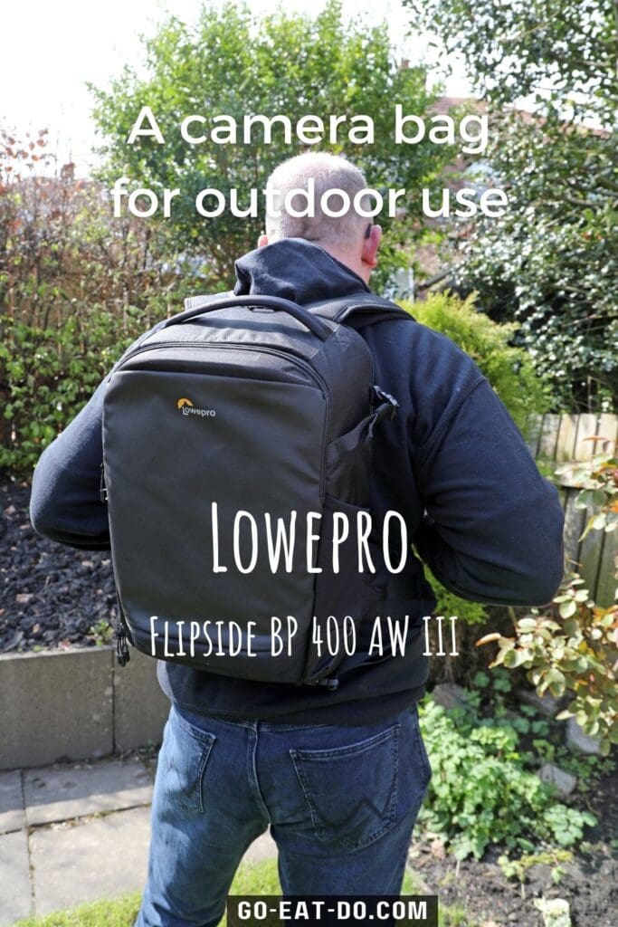 Pinterest pin for Go Eat Do's review of the Lowepro Flipside BP 400 AW III camera bag.