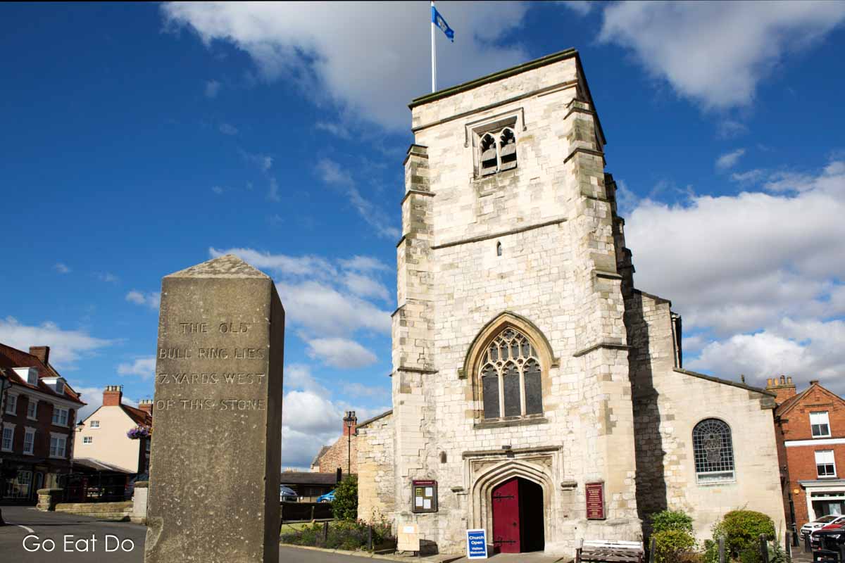 Obelisk inscribed with the location of the historic bull ring next to St Michael's Church in Malton, on the Yorkshire town's Market Place.