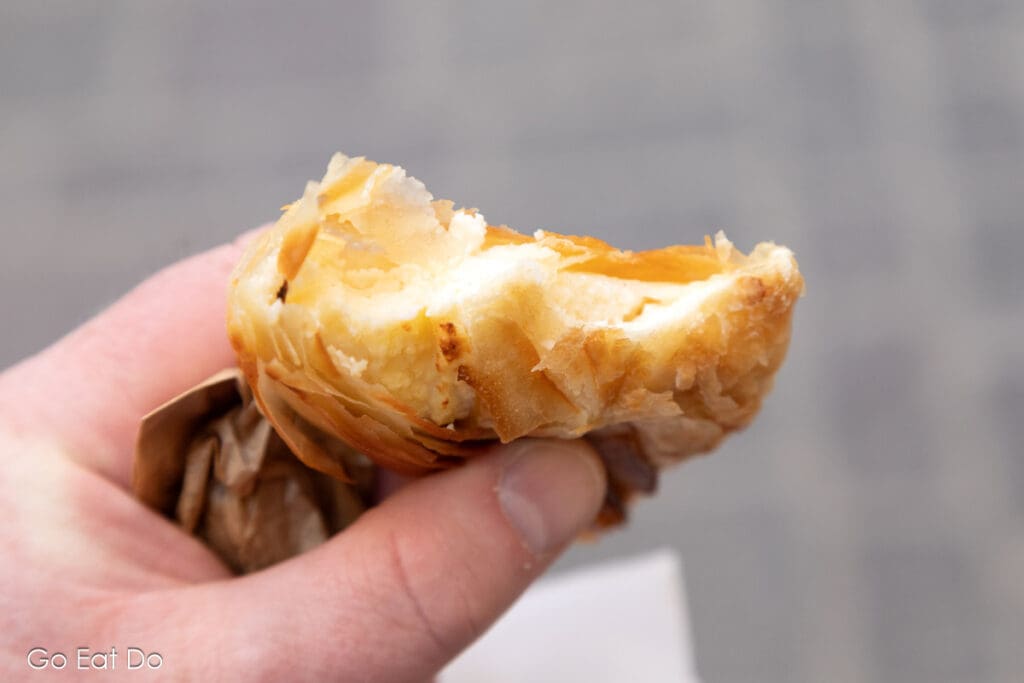 A ricotta-filled pastizzi from a bakery in Valletta is an ideal way of trying traditional food in Malta.